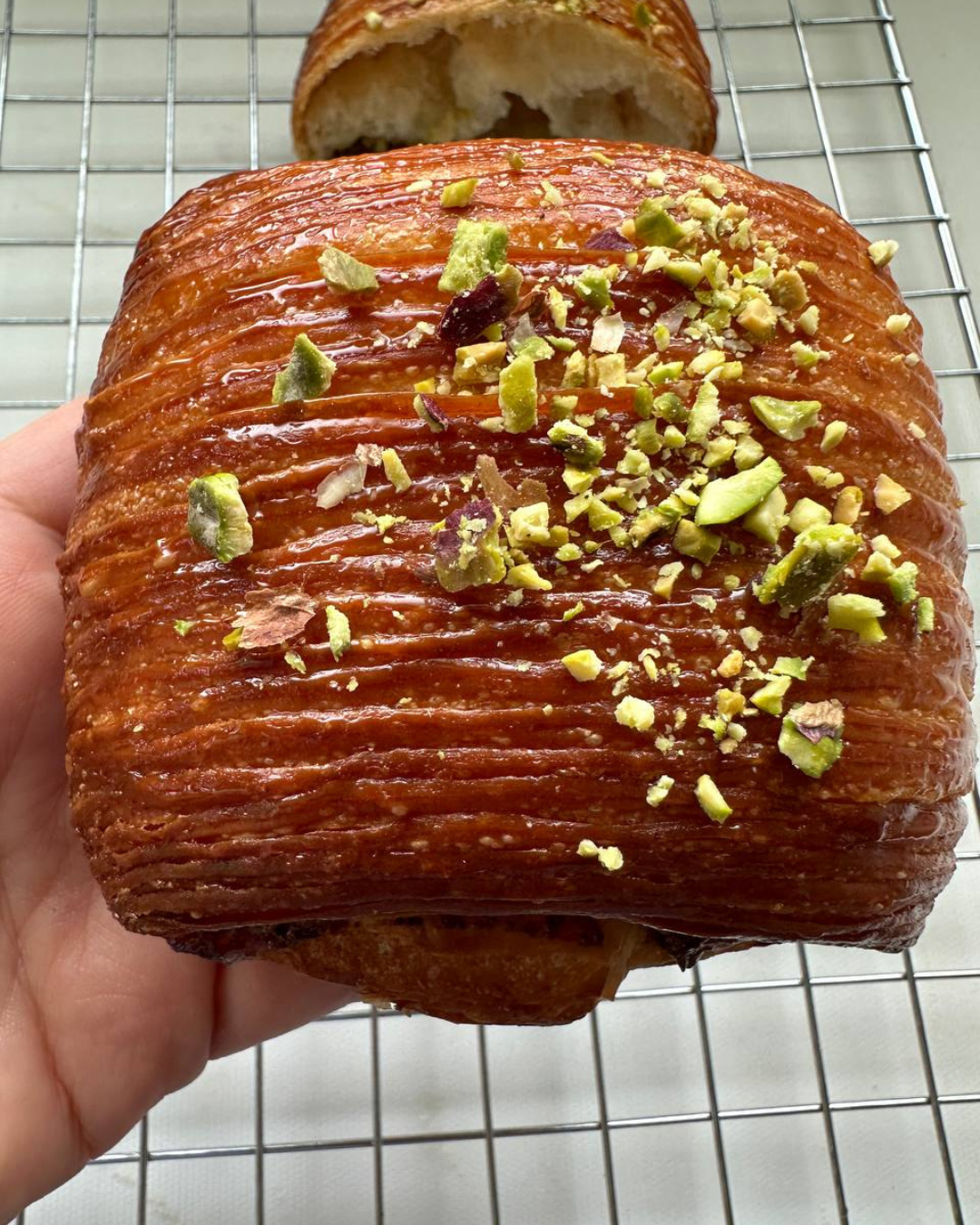 Praline pistachio croissant with white chocolate cream